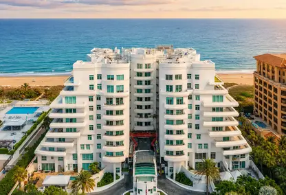 Aragon Condominium in Boca Raton at sunset with ocean views, tropical landscaping, and luxury beachfront real estate.