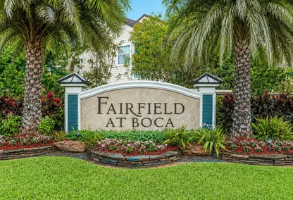 Fairfield at Boca neighborhood entrance in Boca Raton with tropical landscaping, palm trees, and South Florida real estate community appeal.