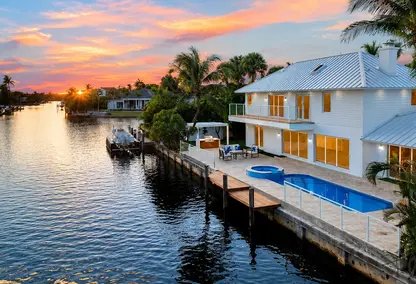 Estoville Boca Raton waterfront home with pool, private dock, canal views, and luxury South Florida real estate appeal.