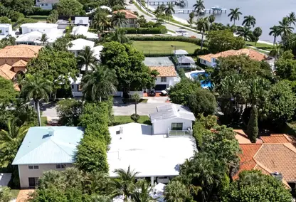 Seville luxury neighborhood in West Palm Beach, South Florida featuring tropical homes, lush landscaping, and waterfront views.