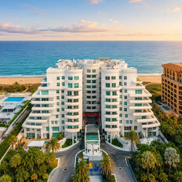 Aragon Condominium in Boca Raton at sunset with ocean views, tropical landscaping, and luxury beachfront real estate.