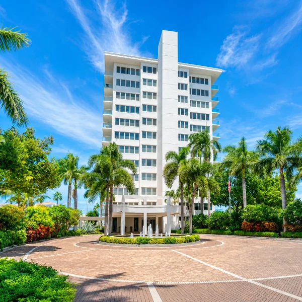 Boca Inlet Condo in Boca Raton with waterfront views, tropical landscaping, marina access, and South Florida luxury real estate appeal.
