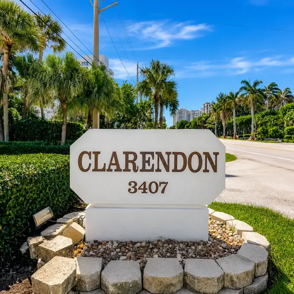 Clarendon Condo Highland Beach entrance sign with palm trees, coastal landscaping, and luxury South Florida condominium lifestyle.