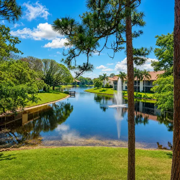 Coach Houses of Town Place Boca Raton aerial view with lakefront homes, greenery, and luxury South Florida real estate.