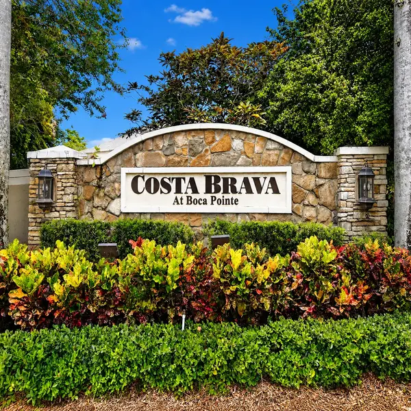 Costa Brava at Boca Pointe neighborhood sign in Boca Raton with lush landscaping and luxury South Florida real estate appeal.