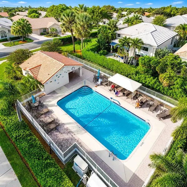 Costa Brava Boca Raton resort-style community pool with tropical palms, lounge areas, and Boca Pointe luxury living.
