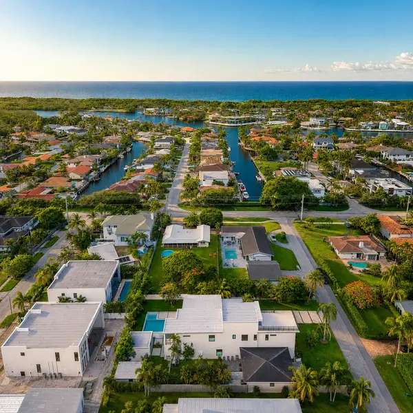 Cushman Alain Boca Raton waterfront neighborhood aerial with canal homes, ocean views, and luxury coastal real estate.