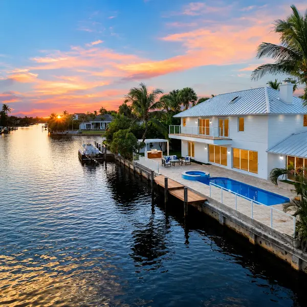 Estoville Boca Raton waterfront home with pool, private dock, canal views, and luxury South Florida real estate appeal.
