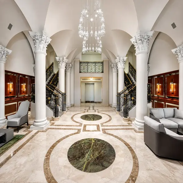 Excelsior Boca Raton grand lobby with marble floors, chandelier, columns, and luxury condominium interiors.