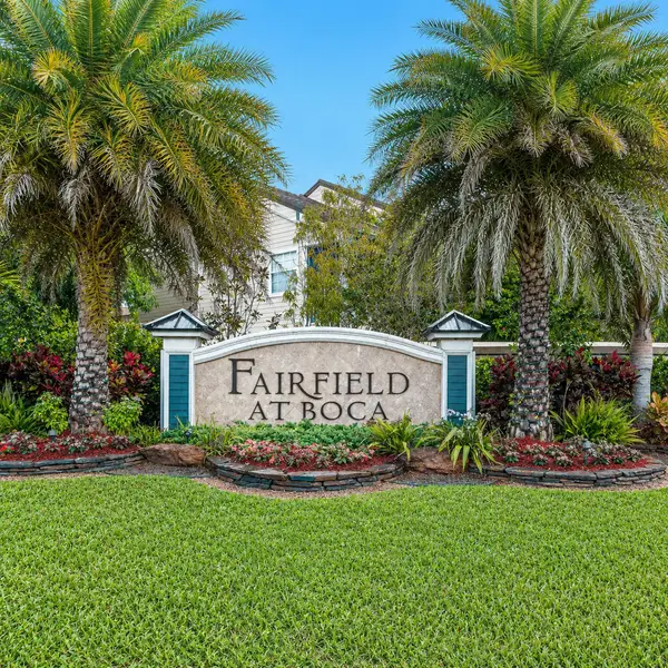 Fairfield at Boca neighborhood entrance in Boca Raton with lush palm trees, landscaped sign, and desirable South Florida real estate setting.