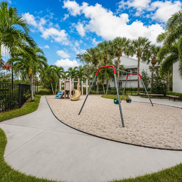 Fairfield at Boca Boca Raton playground with palm trees, family-friendly amenities, and attractive residential real estate community lifestyle.