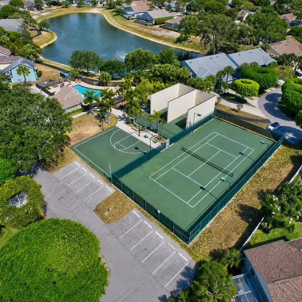Fairfield at Boca subdivision in Boca Raton with tennis courts, recreation areas, lake views, and South Florida real estate amenities.
