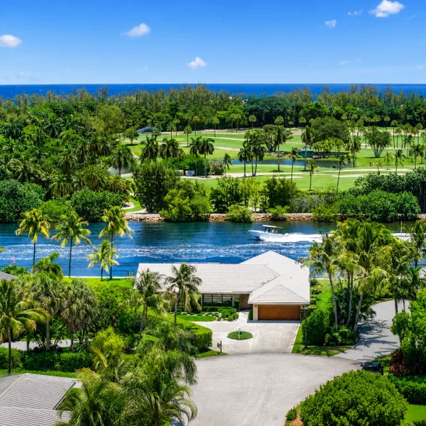 Gulf Stream Town South Florida waterfront luxury real estate home with Intracoastal views, golf course scenery, and tropical landscaping.