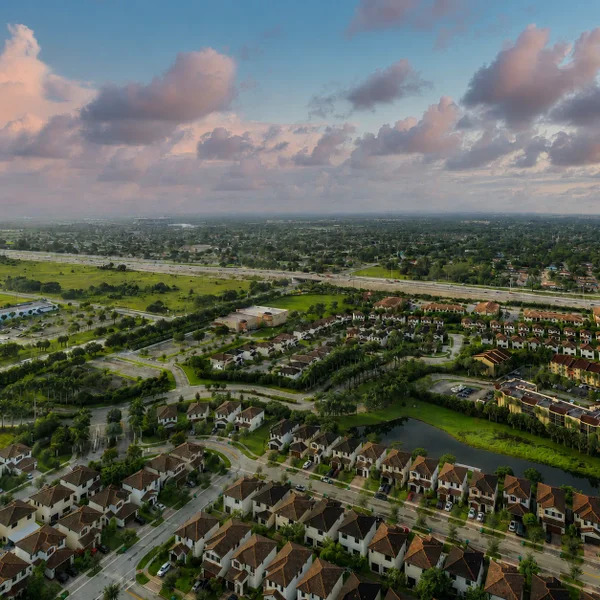 Miramar City Luxury real estate view in South Florida with waterfront neighborhoods, tile-roof homes, and tropical landscaping.