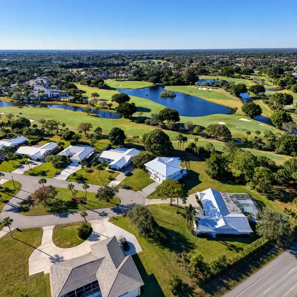 Palm Beach Gardens luxury condo community with scenic lakefront views, resort-style surroundings, high-rise residences, and premium South Florida real estate appeal.