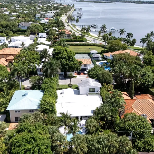 Seville luxury neighborhood in West Palm Beach, South Florida featuring tropical homes, lush landscaping, and waterfront views.