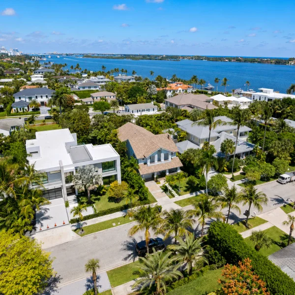 Aerial view of Toledo Neighborhood in West Palm Beach with waterfront estates, palm-lined streets, and luxury real estate lifestyle.