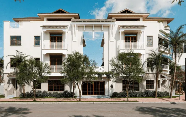 Casa Avenida exterior rendering in Delray Beach with Mediterranean-style architecture and palm-lined entrance.