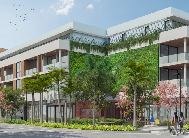 Corner view of Onix Delray, a modern condo with a green living wall, glass balconies, and great landscaping.