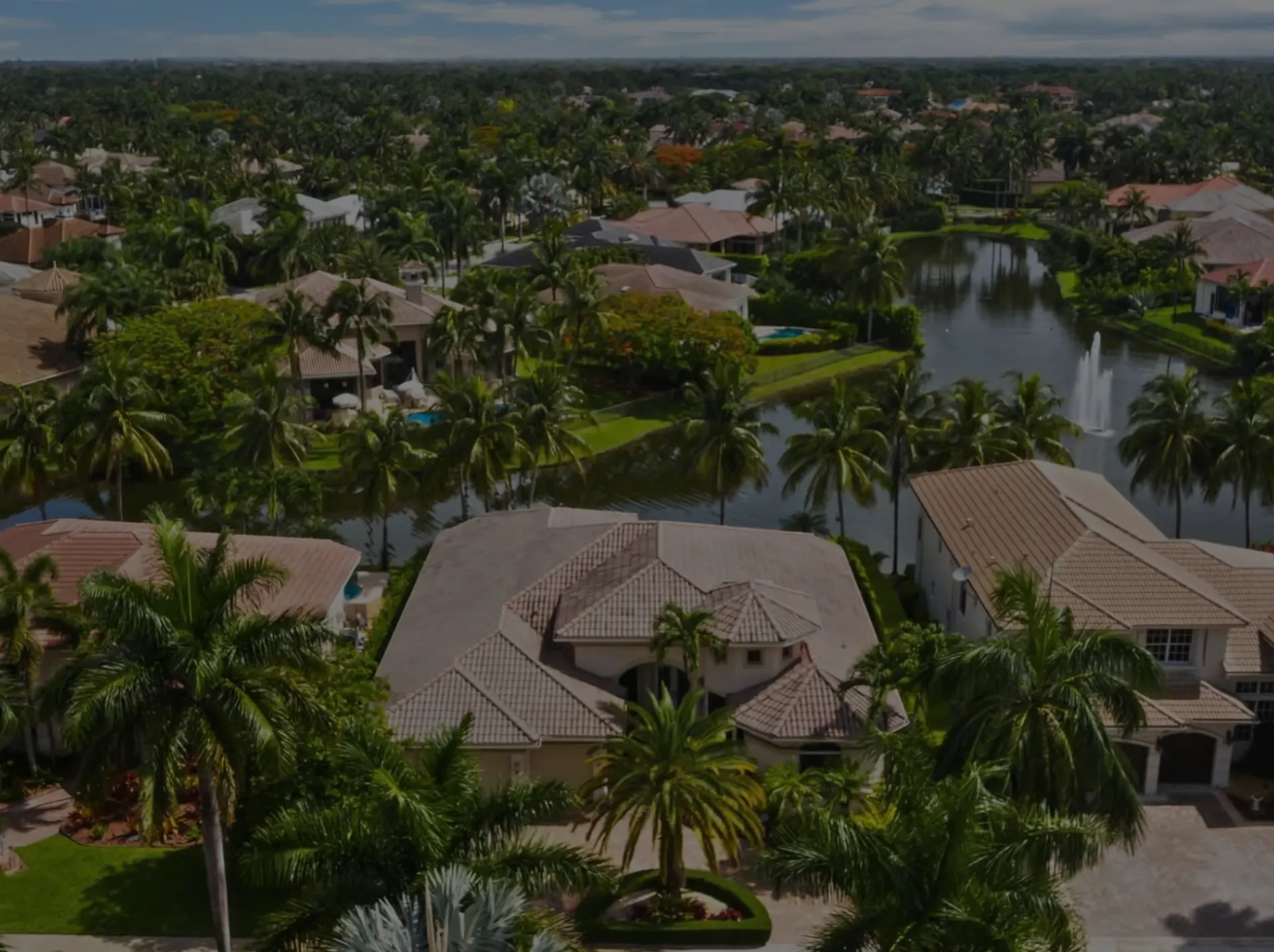 Aerial views of ranch-style homes among trees in Plantation, FL.