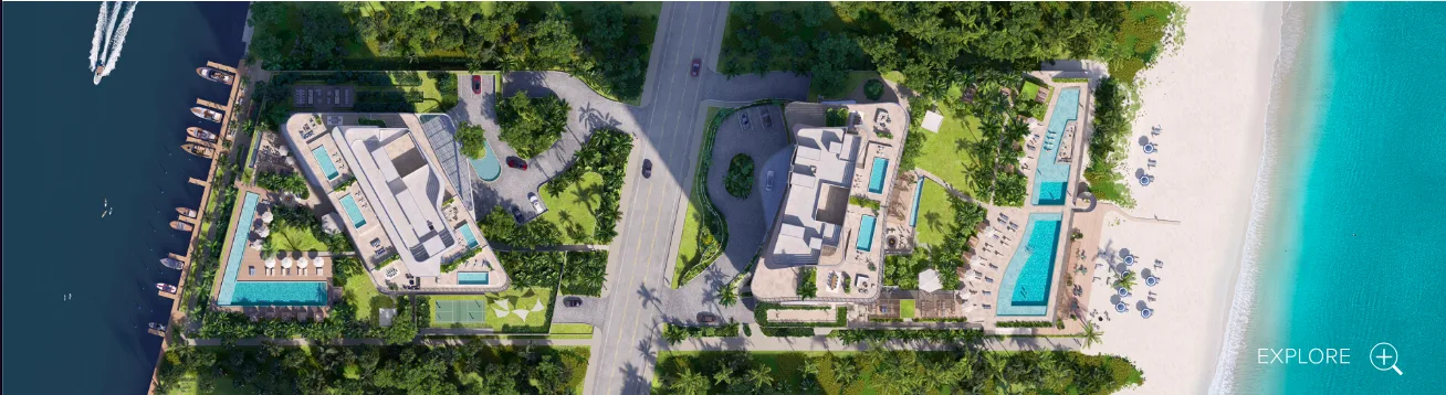Aerial view of The Ritz-Carlton Residences Pompano Beach construction site showing glass façade and ocean backdrop.
