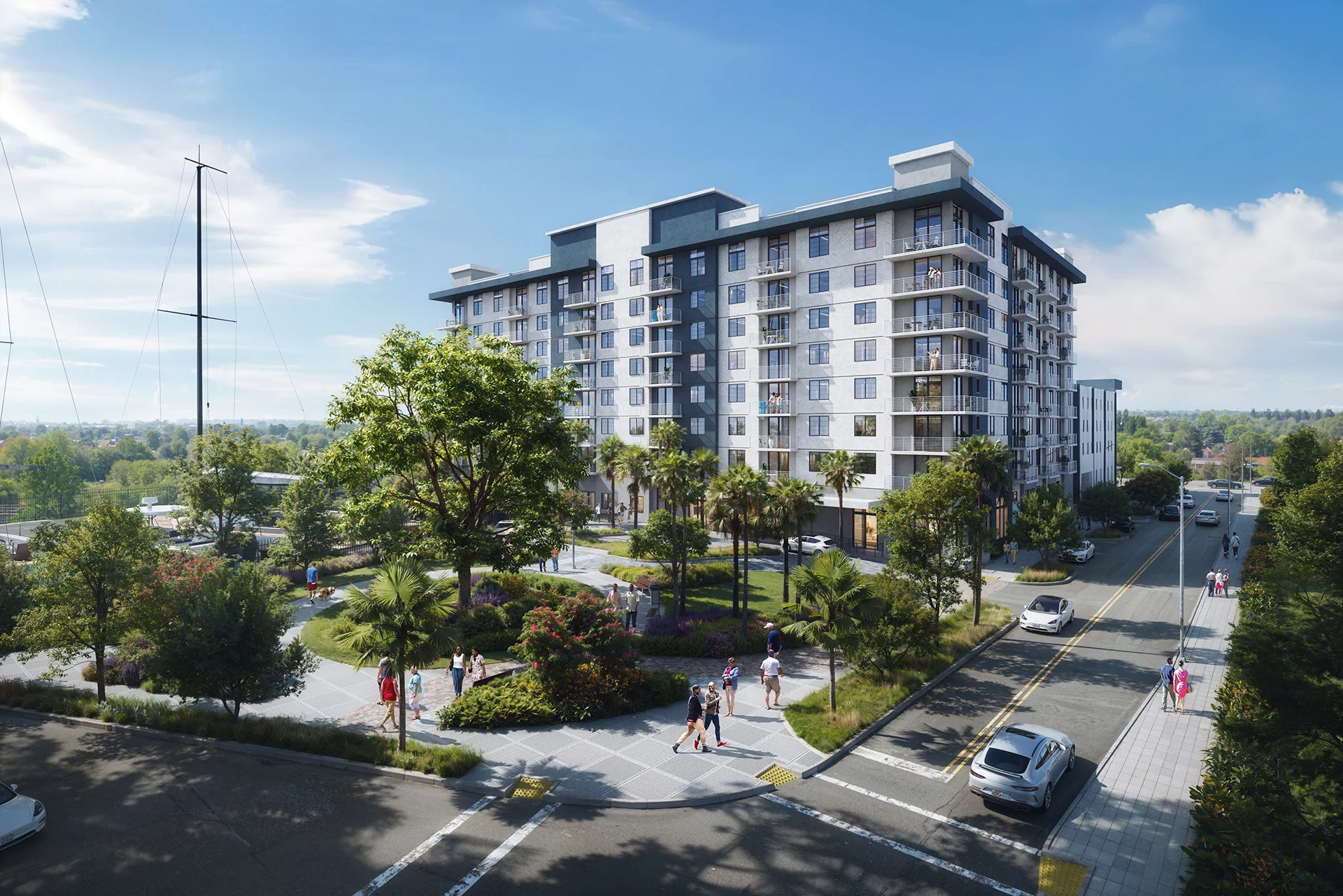 Street-level view of Marina Village redevelopment in Riviera Beach, featuring modern retail, pedestrian walkways, and a structured parking facility
